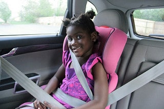 Child in a car booster seat