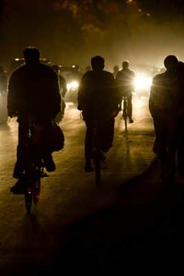 Highway cyclists riding in the dark