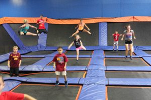 kids jumping on trampolines