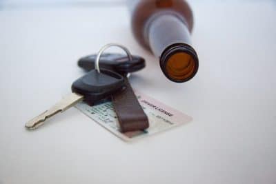 car keys and alcohol bottle