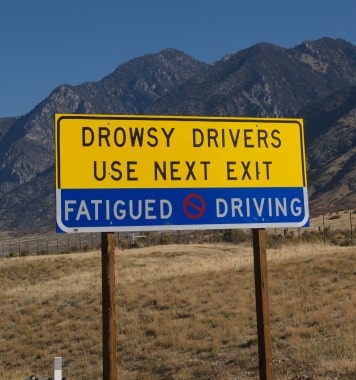 Warning sign for drowsy drivers to pull over at next exit