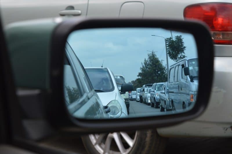 Cars reflected in side mirror