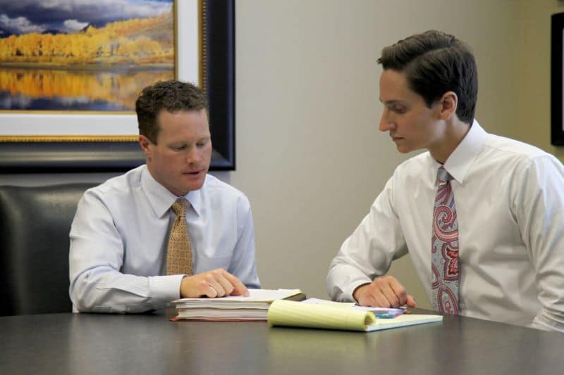 Christensen & Hymas attorneys discussing wrongful death client's case