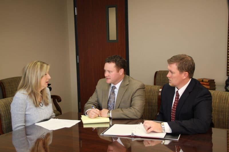 Utah car accident attorneys working with client to file insurance claim