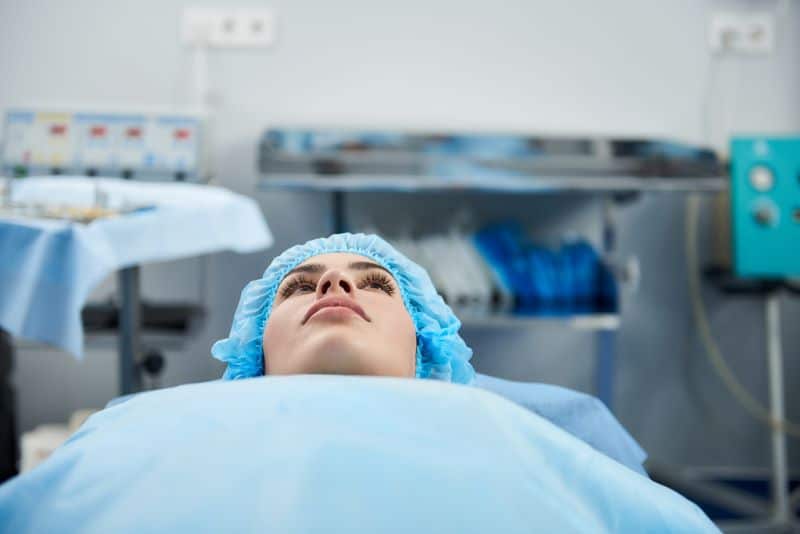 female patient about to have surgery to fix her internal bleeding