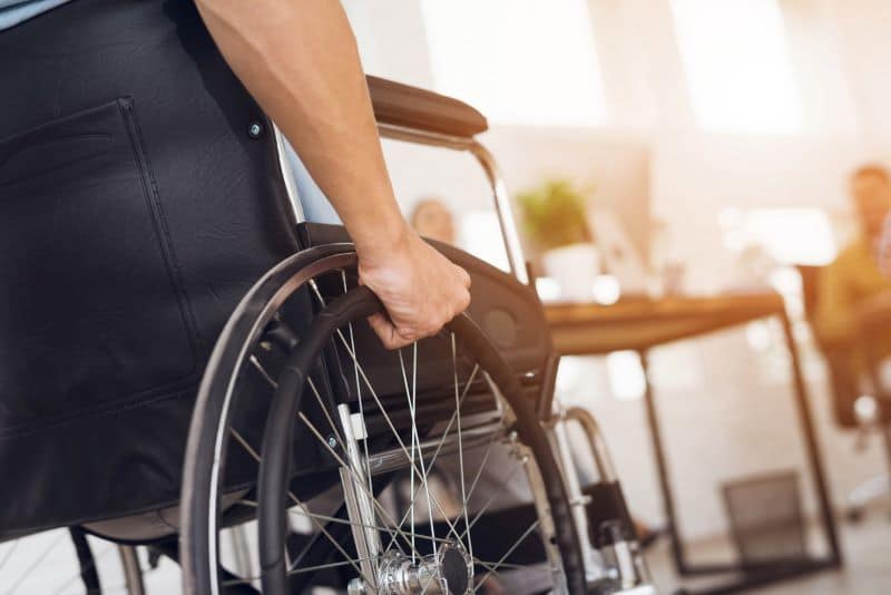 man in a wheelchair due to a spinal cord injury