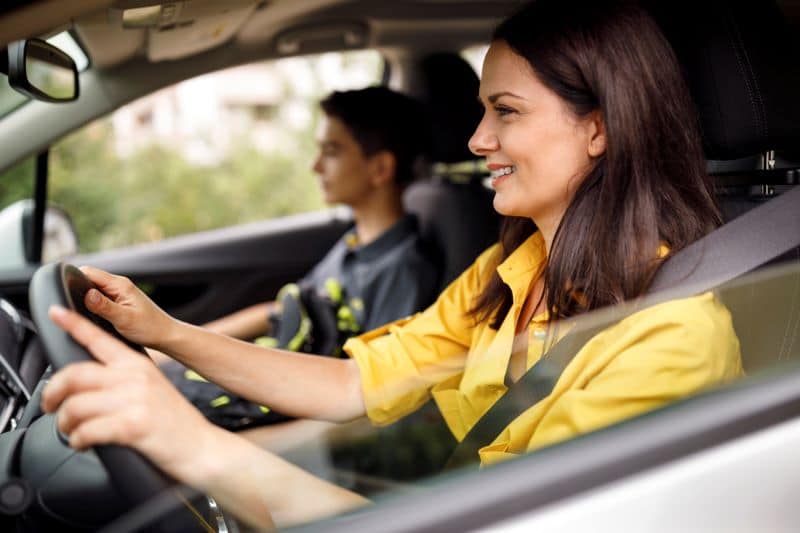 woman driving safely and focusing on her surroundings