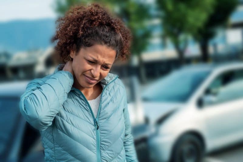 woman suffering whiplash after car crash