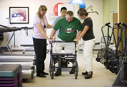 spinal injury veteran in physical therapy session